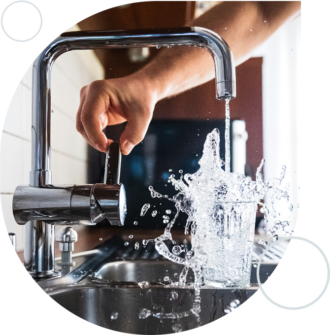 A person is washing their hands in the sink.